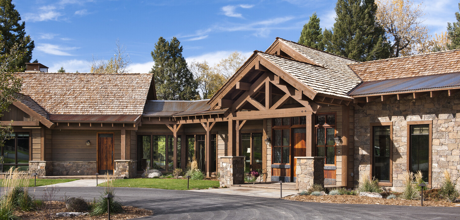 Stone, Steel, and Rustic Prefinished ranchwood™ Wood Siding and AquaFir™ Beams