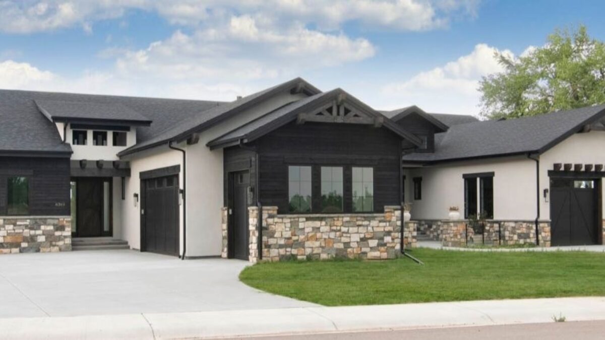 Mixed siding materials featuring AquaFir™ black wood and stucco