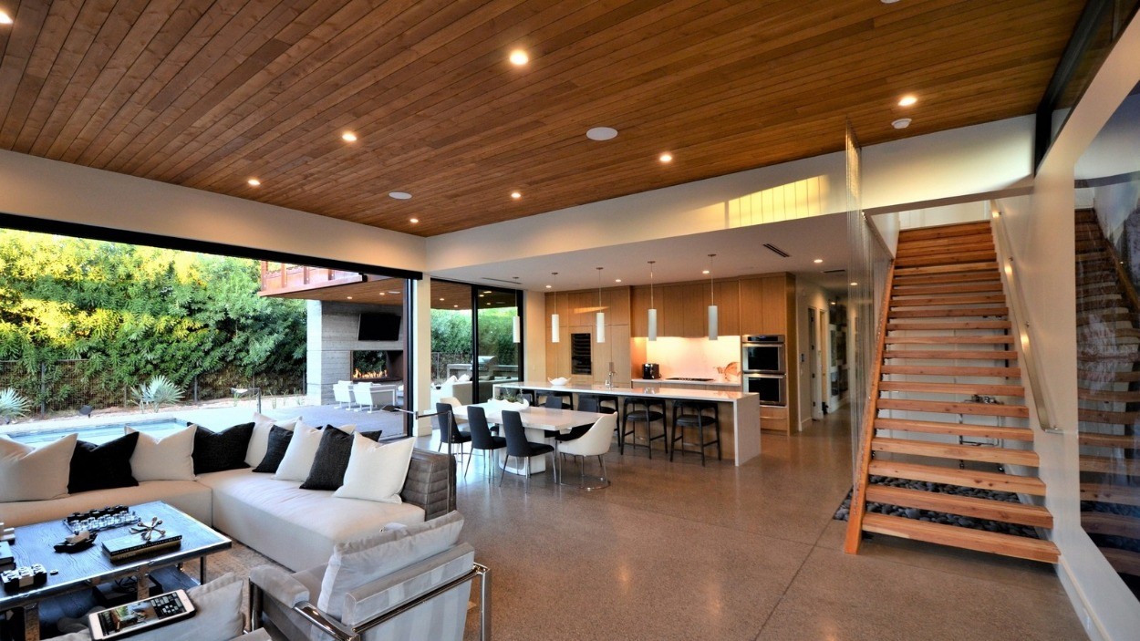 Pre-finished cedar wood ceilings and soffits add warmth to this modern design