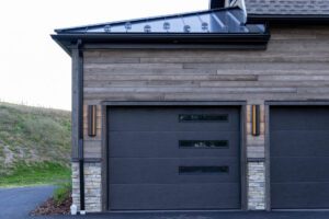 Garage Door Black Accent Details against ranchwood Artisan siding