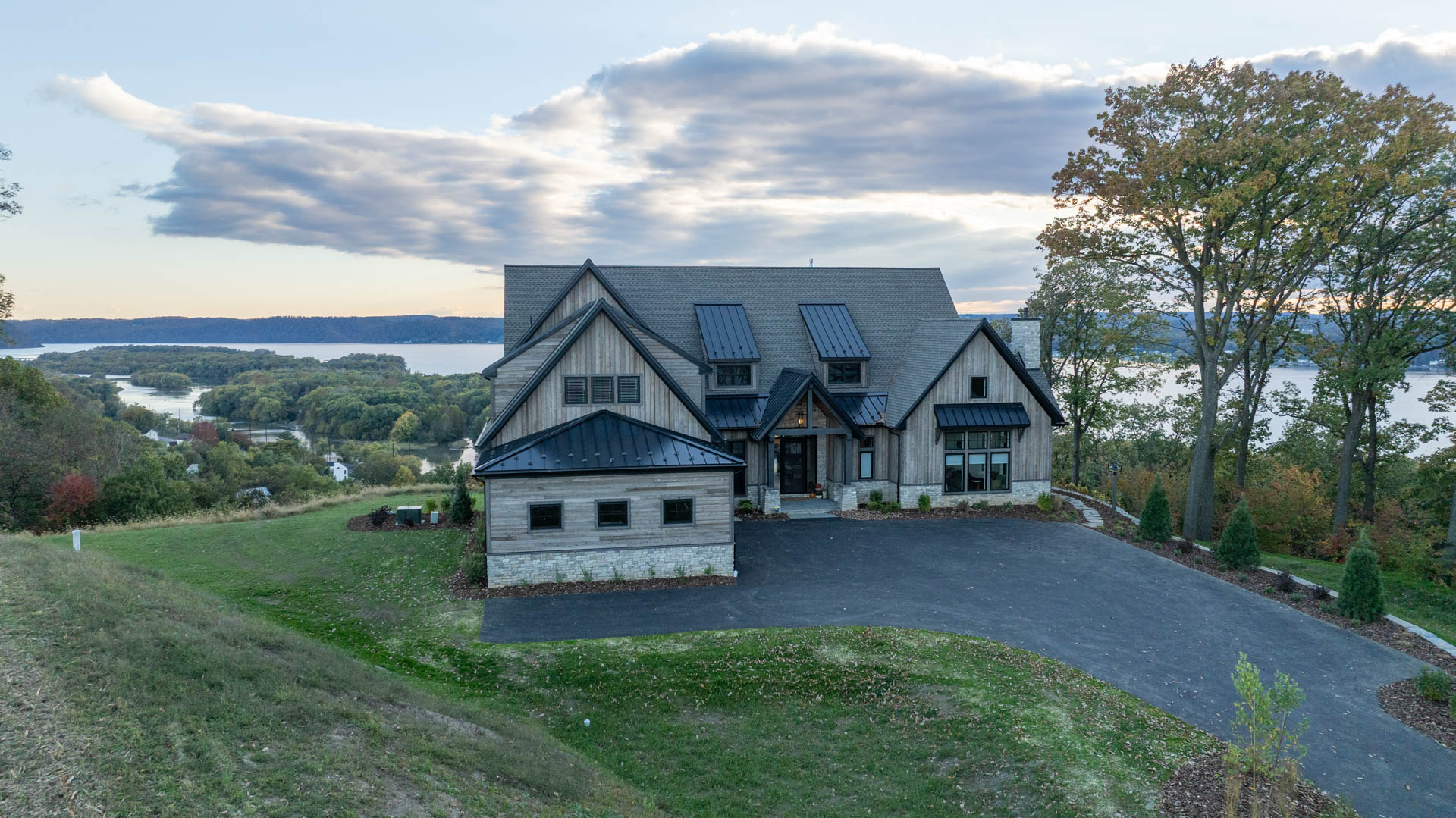 Front of Craftsman Hero Western Red Cedar ship lap siding in Homestead finish on a Pennsylvania home along the Susquehanna River.