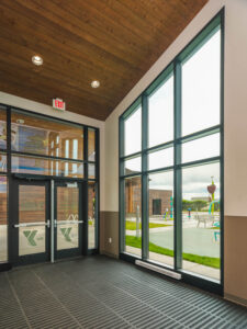 Showing High Ceilings with AquaFir Brown soffits at nursery entrance